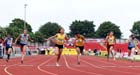 No 77 Maya Bruney (Surrey) wins the Junior Girls 100 metres.